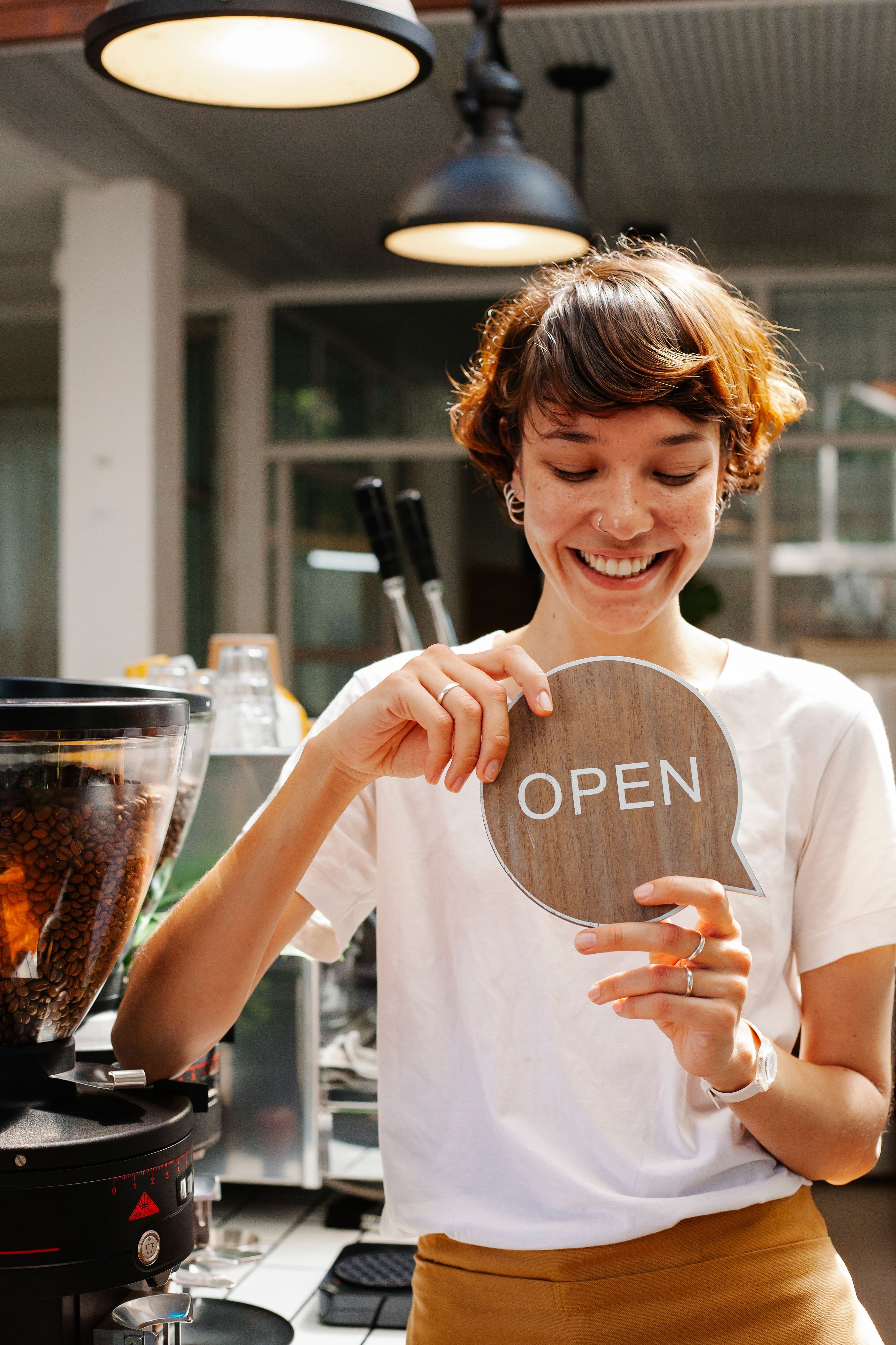 Cafe owner behind the counter, candidly captured