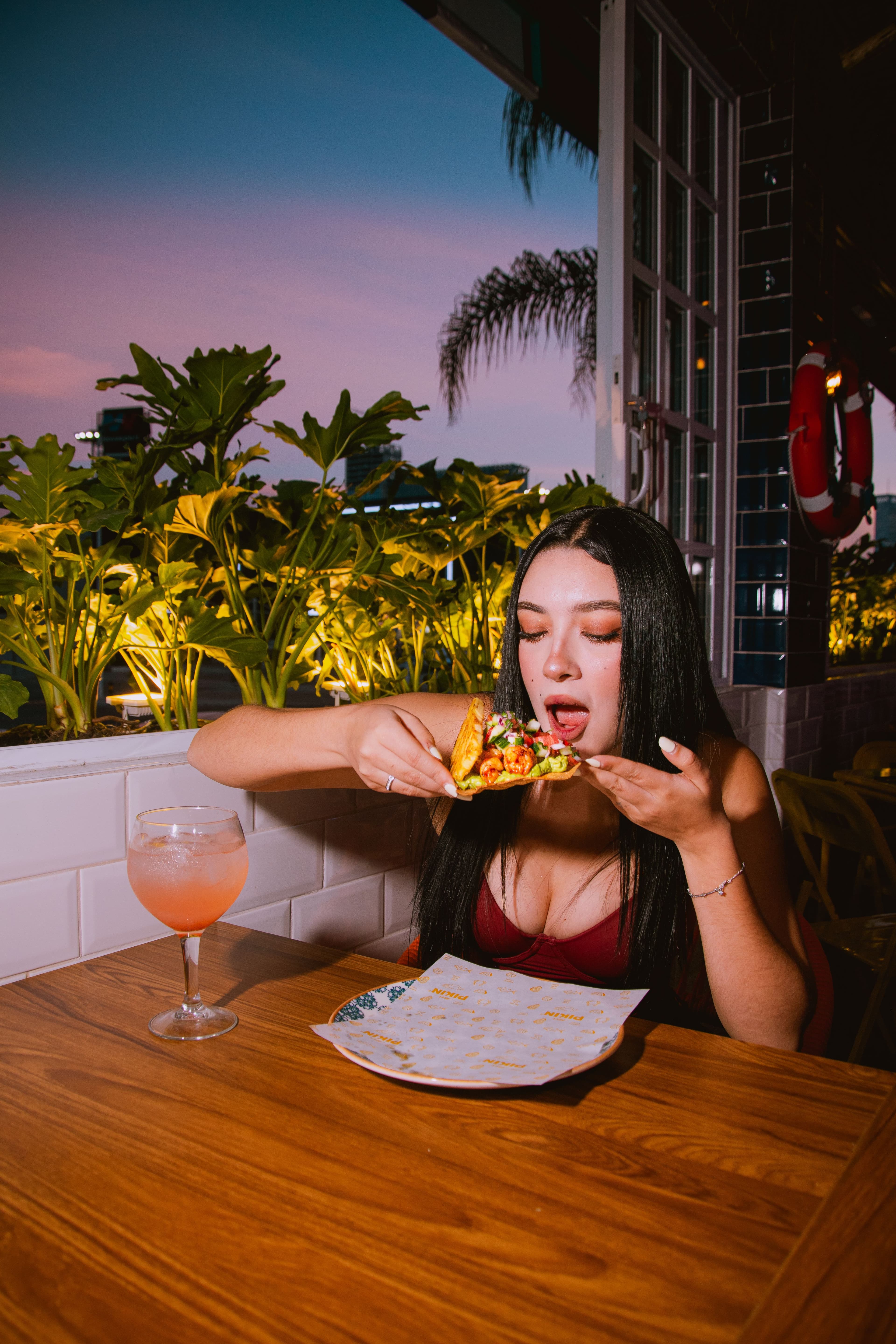 Plated dish on a rooftop table at sunset